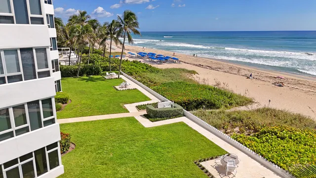 a view of a big yard with lots of green space