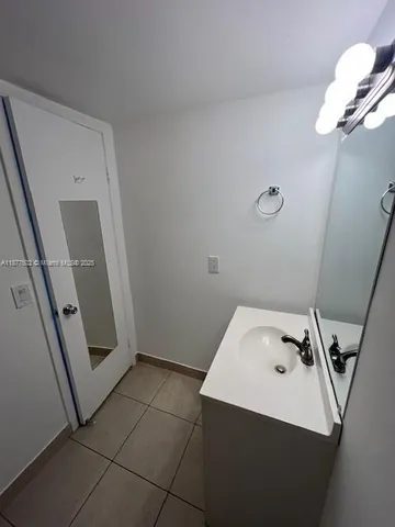 a bathroom with a sink a toilet and vanity