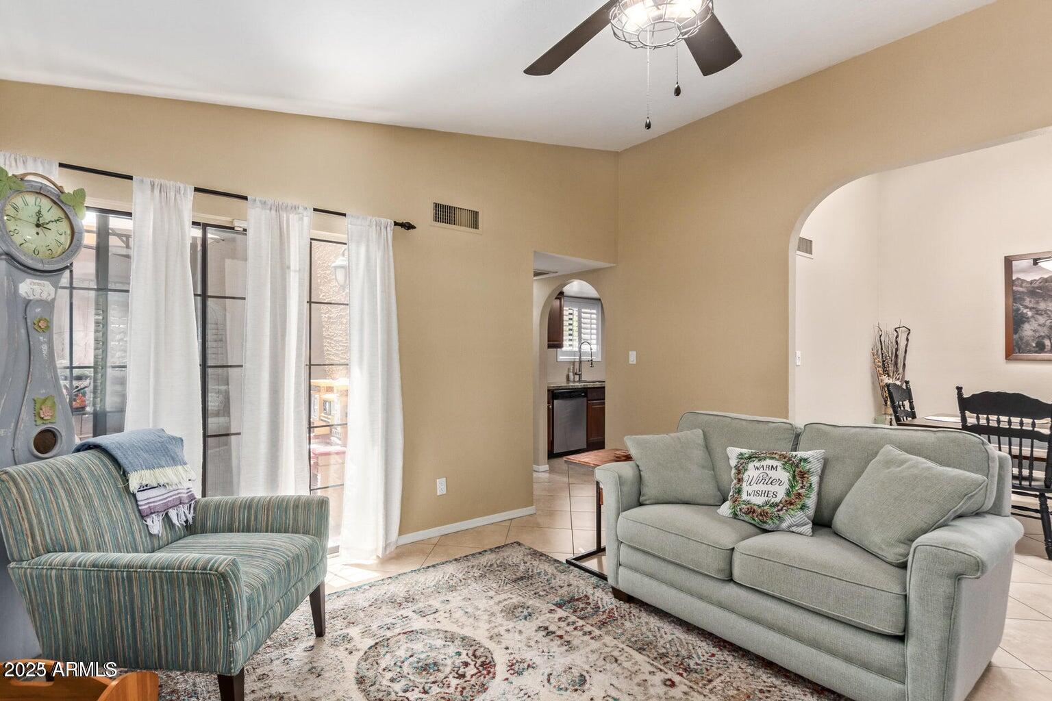 6945 East Cochise Road, Unit 130 Paradise Valley, AZ 85253 - Photo 5 of 24 a living room with furniture and a large window