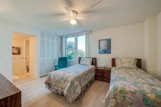 a spacious bathroom with a granite countertop sink a mirror and a