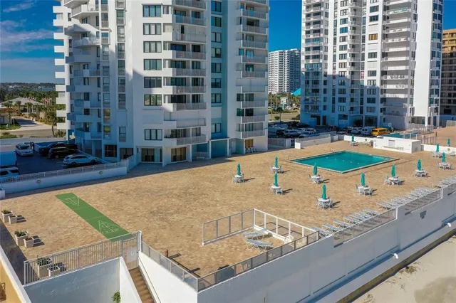 a view of a swimming pool with chairs