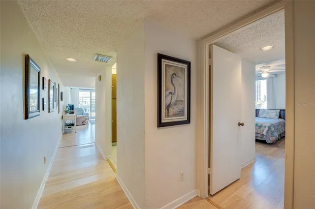 a view of room with wooden floor and white walls