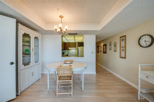 a kitchen with stainless steel appliances granite countertop a stove a sink dishwasher and a refrigerator