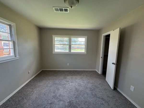 an empty room with windows