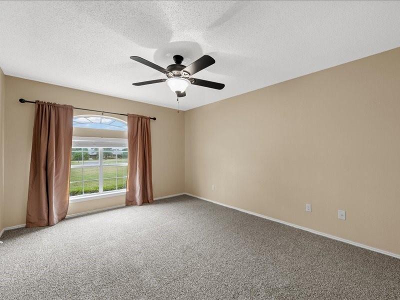 1072 Chapman Road Crawford, TX 76638 - Photo 24 of 39 an empty room with windows and fan
