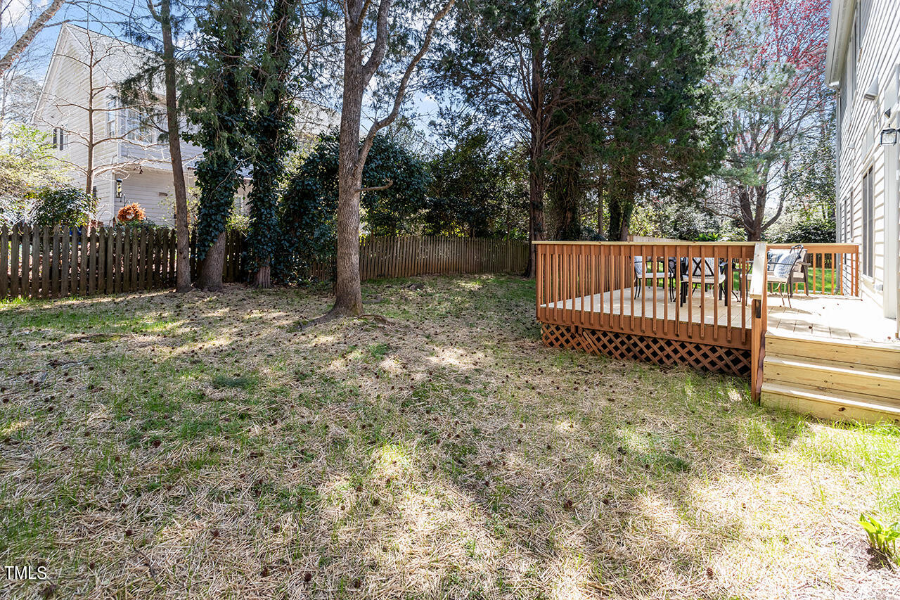 9004 Admaston Drive Raleigh, NC 27613 - Photo 14 of 30 Your backyard with a spacious deck and fenced in yard.