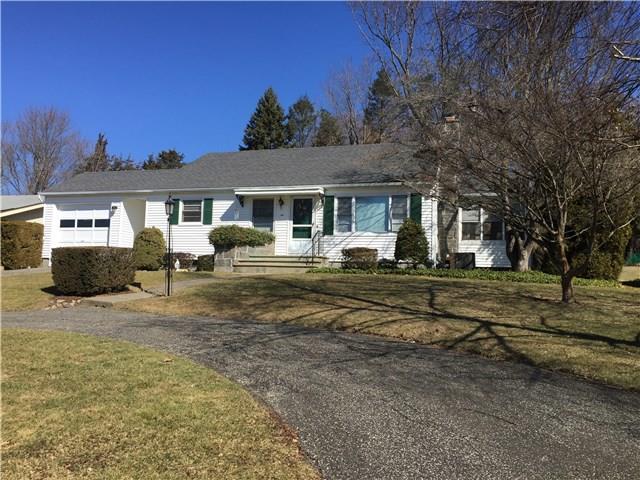 Front view, paved circular driveway