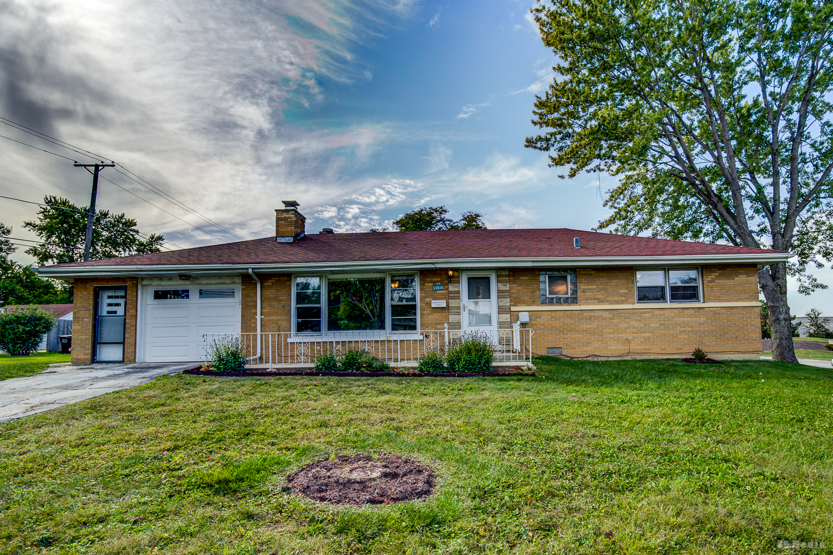 17510 Western Avenue Homewood, IL 60430 - Photo 13 of 19 a front view of a house with a yard and garage