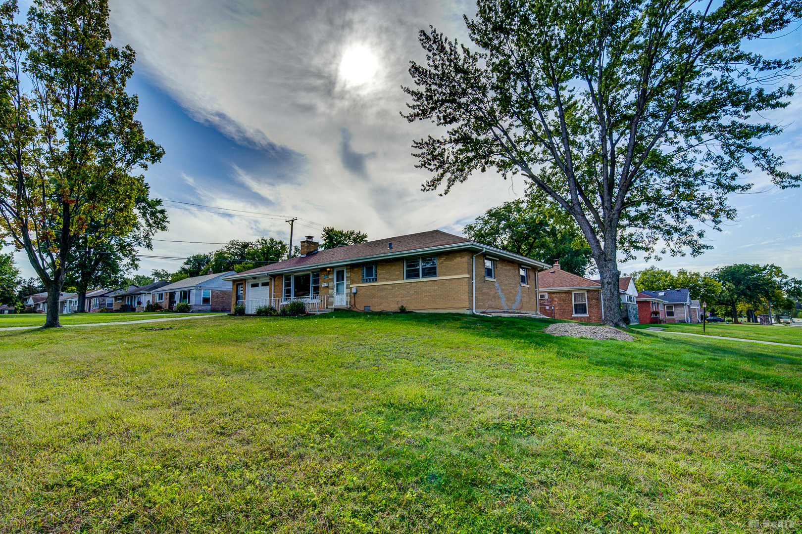 17510 Western Avenue Homewood, IL 60430 - Photo 17 of 19 a front view of a house with garden