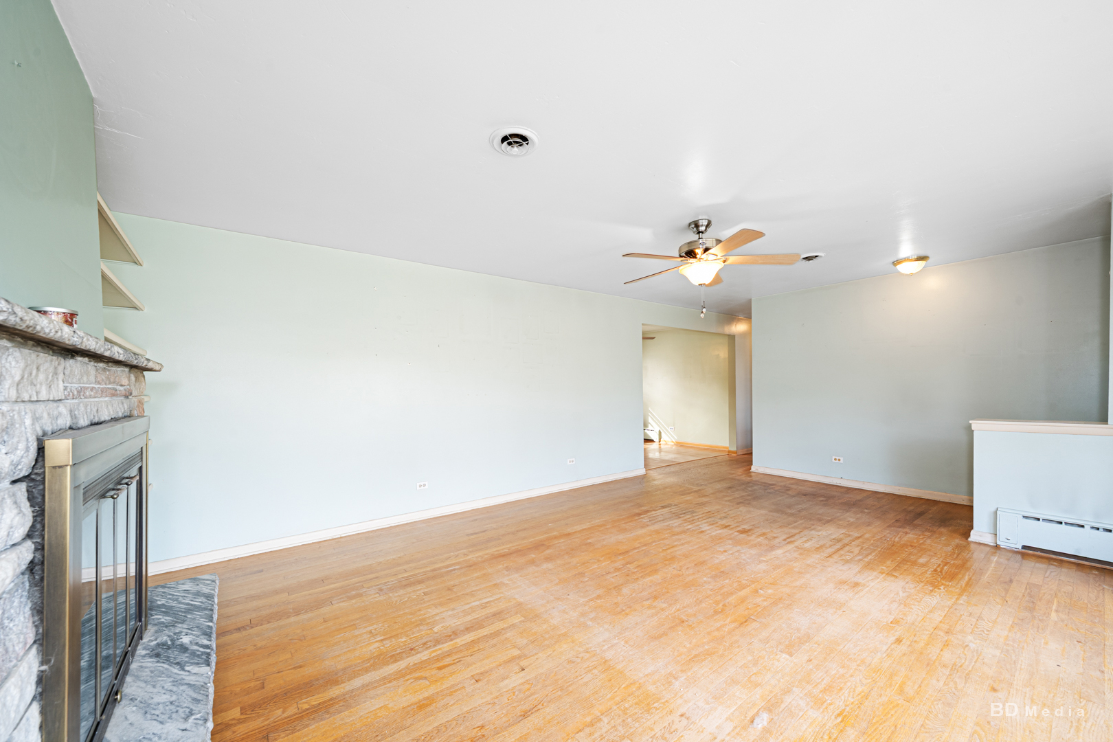 17510 Western Avenue Homewood, IL 60430 - Photo 3 of 19 a view of a big room with a ceiling fan and a window