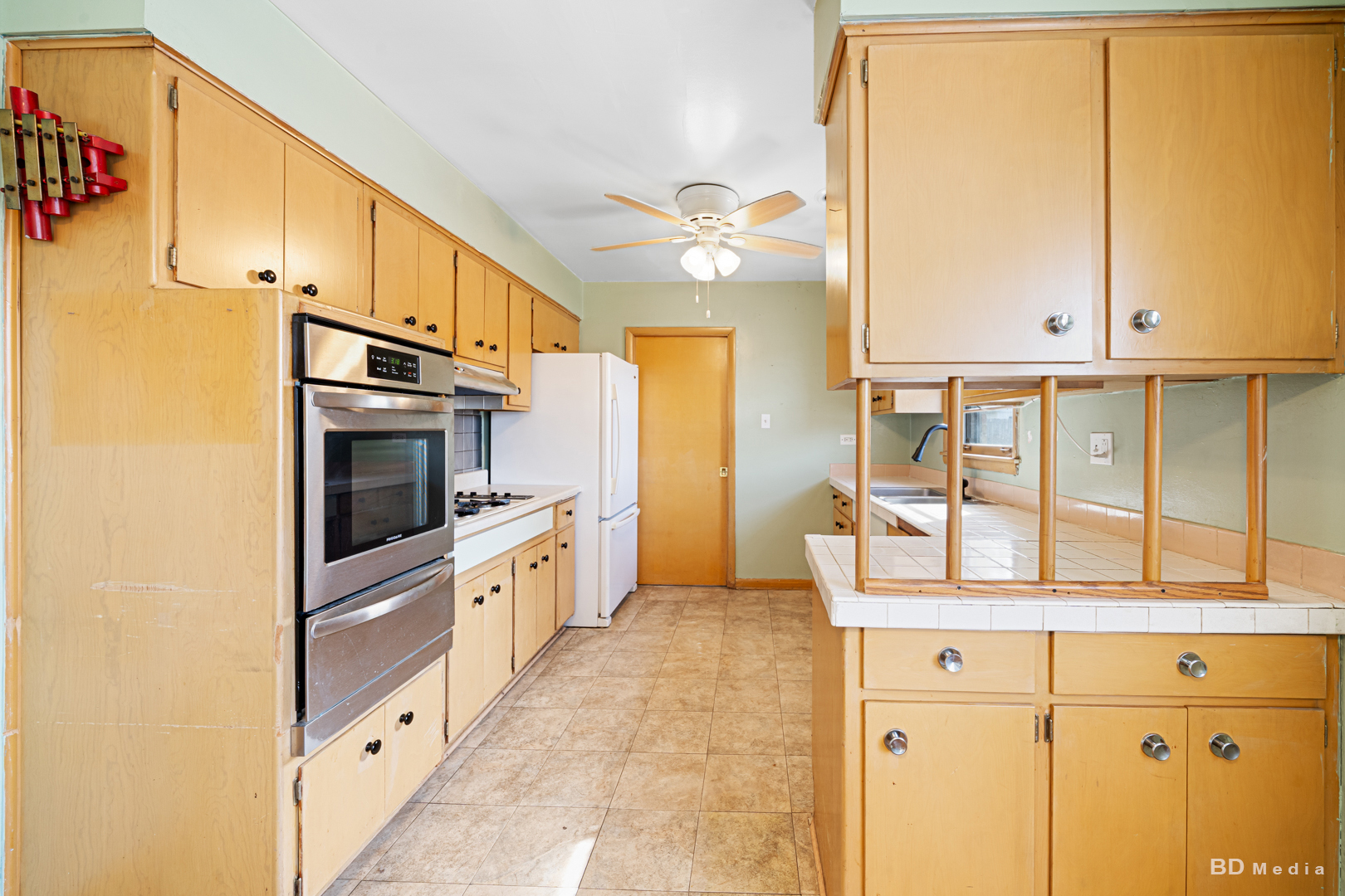 17510 Western Avenue Homewood, IL 60430 - Photo 5 of 19 a kitchen with stainless steel appliances a sink and a refrigerator