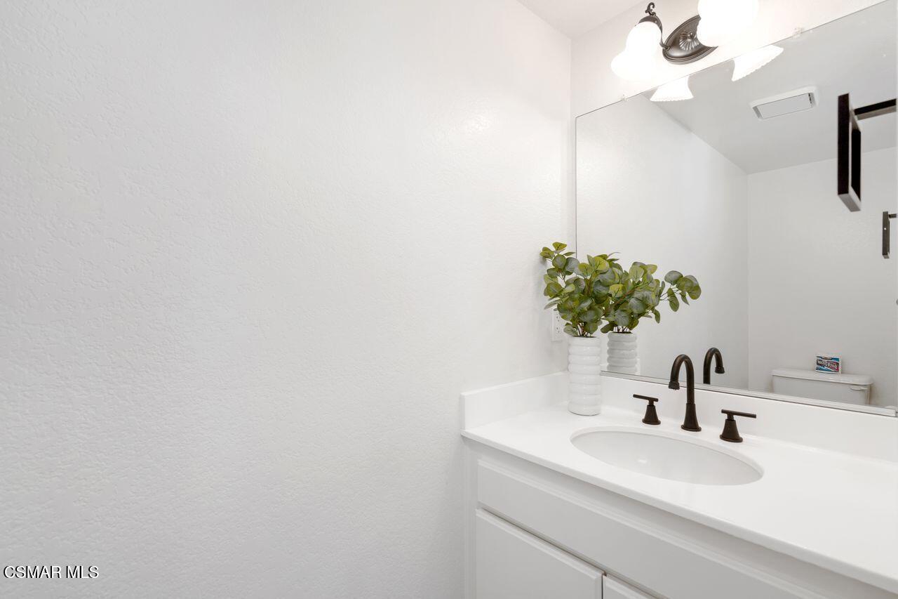1854 Rory Lane, Unit 4 Simi Valley, CA 93063 - Photo 15 of 37 a bathroom with a sink and a mirror