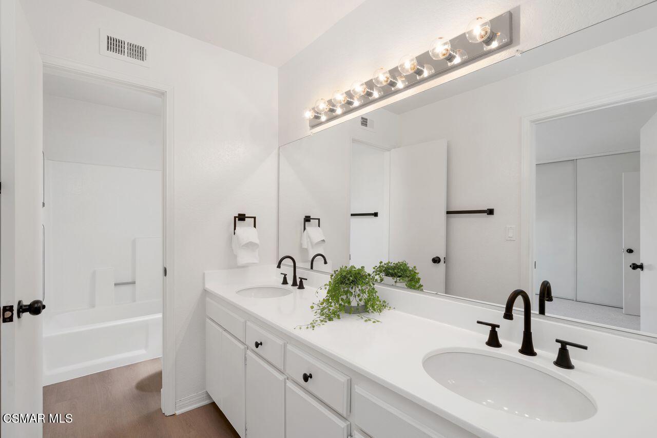 1854 Rory Lane, Unit 4 Simi Valley, CA 93063 - Photo 18 of 37 a bathroom with a sink and a mirror