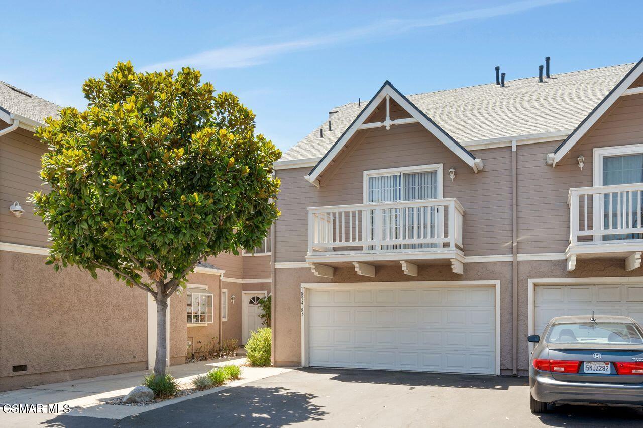 1854 Rory Lane, Unit 4 Simi Valley, CA 93063 - Photo 2 of 37 a view of a house with a yard and garage