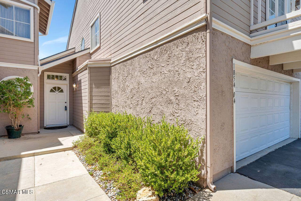 1854 Rory Lane, Unit 4 Simi Valley, CA 93063 - Photo 3 of 37 a view of a pathway along the building