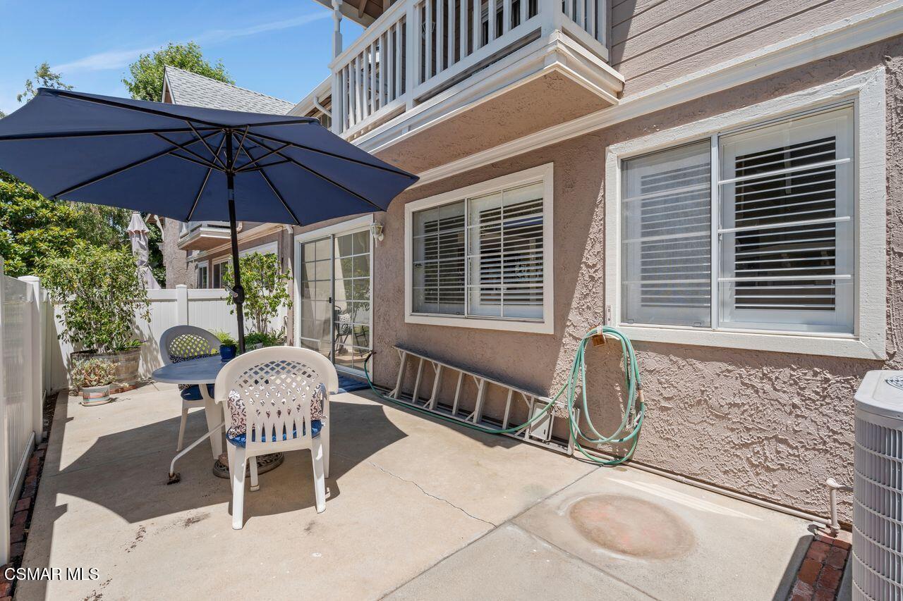1854 Rory Lane, Unit 4 Simi Valley, CA 93063 - Photo 34 of 37 a front view of a house with patio outdoor seating