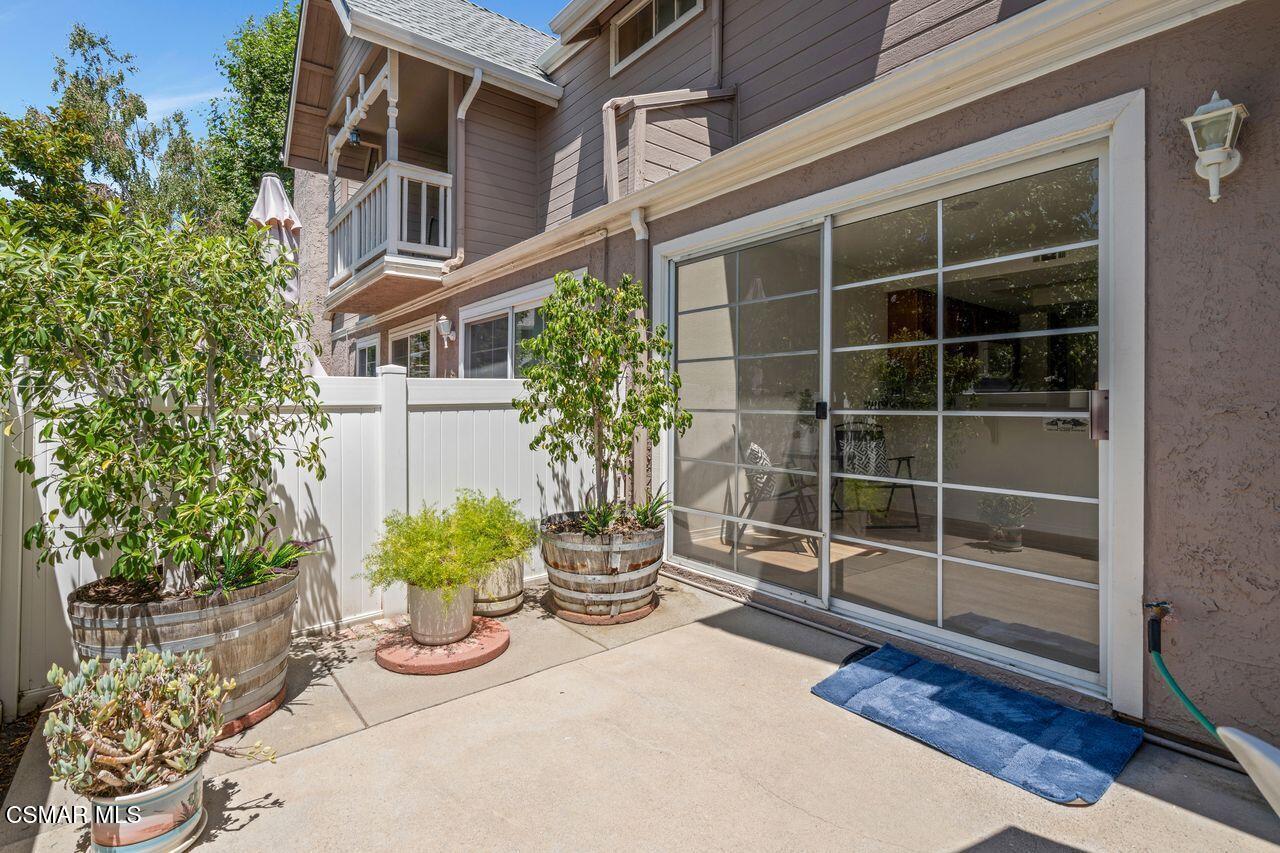 1854 Rory Lane, Unit 4 Simi Valley, CA 93063 - Photo 35 of 37 a potted plant sitting in front of a house