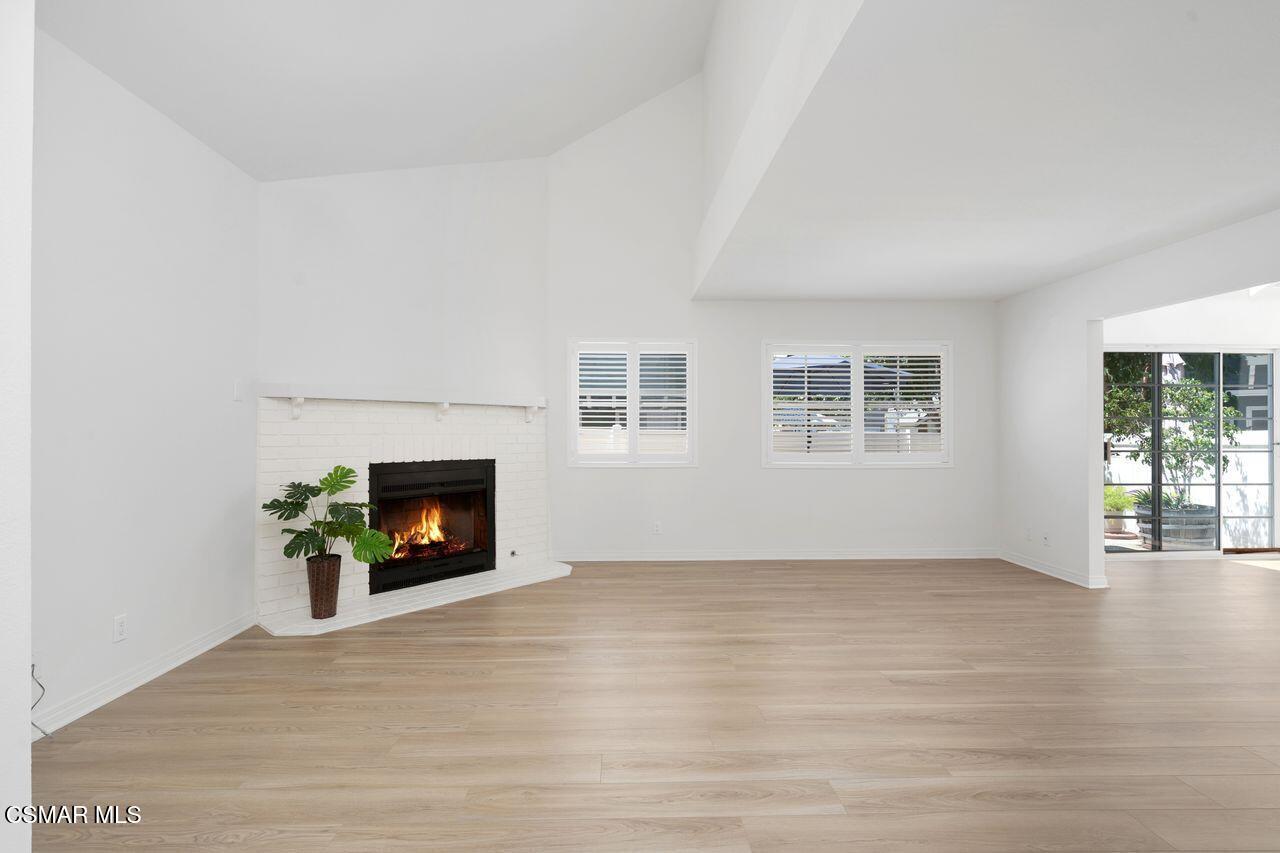 1854 Rory Lane, Unit 4 Simi Valley, CA 93063 - Photo 4 of 37 an empty room with windows and fireplace