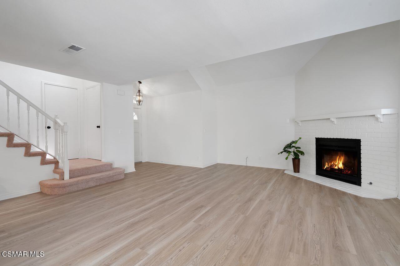 1854 Rory Lane, Unit 4 Simi Valley, CA 93063 - Photo 7 of 37 a view of an empty room and fire place