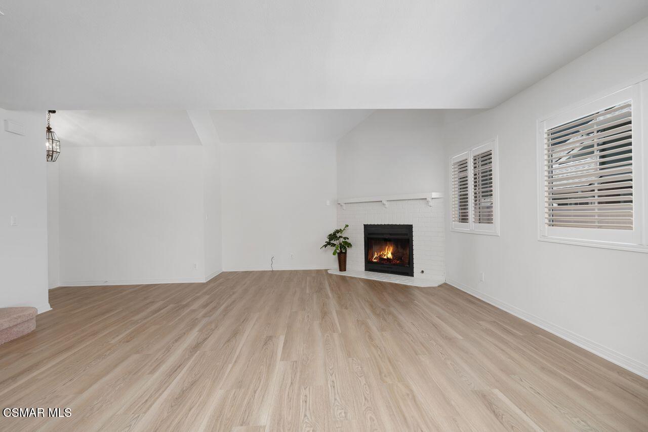 1854 Rory Lane, Unit 4 Simi Valley, CA 93063 - Photo 8 of 37 a view of an empty room with a fireplace and a window