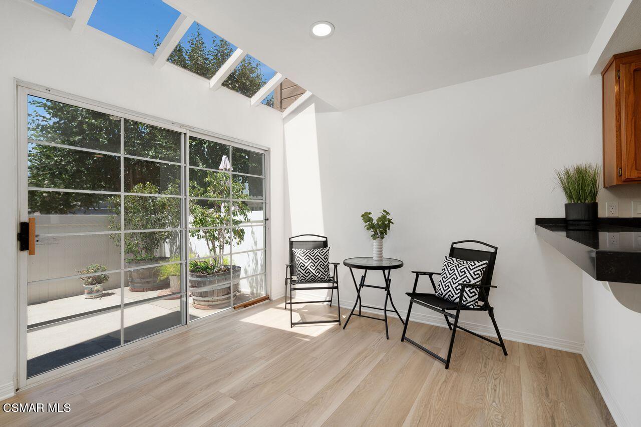 1854 Rory Lane, Unit 4 Simi Valley, CA 93063 - Photo 9 of 37 a dining room with furniture and wooden floor