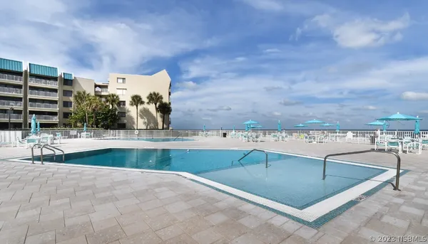 a view of a swimming pool with a terrace