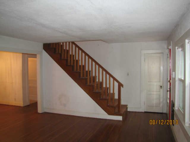 LIVING ROOM - TAKE NOTE OF THOSE GORGEOUS HARDWOOD FLOORS  LEADING INTO FORMAL DINING ROOM.