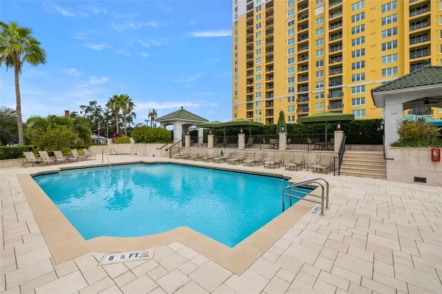 a view of a swimming pool with a lounge chairs