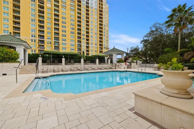 a view of a swimming pool with a lounge chair