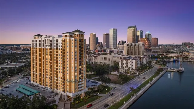 a kitchen with granite countertop a white cabinets and white appliances