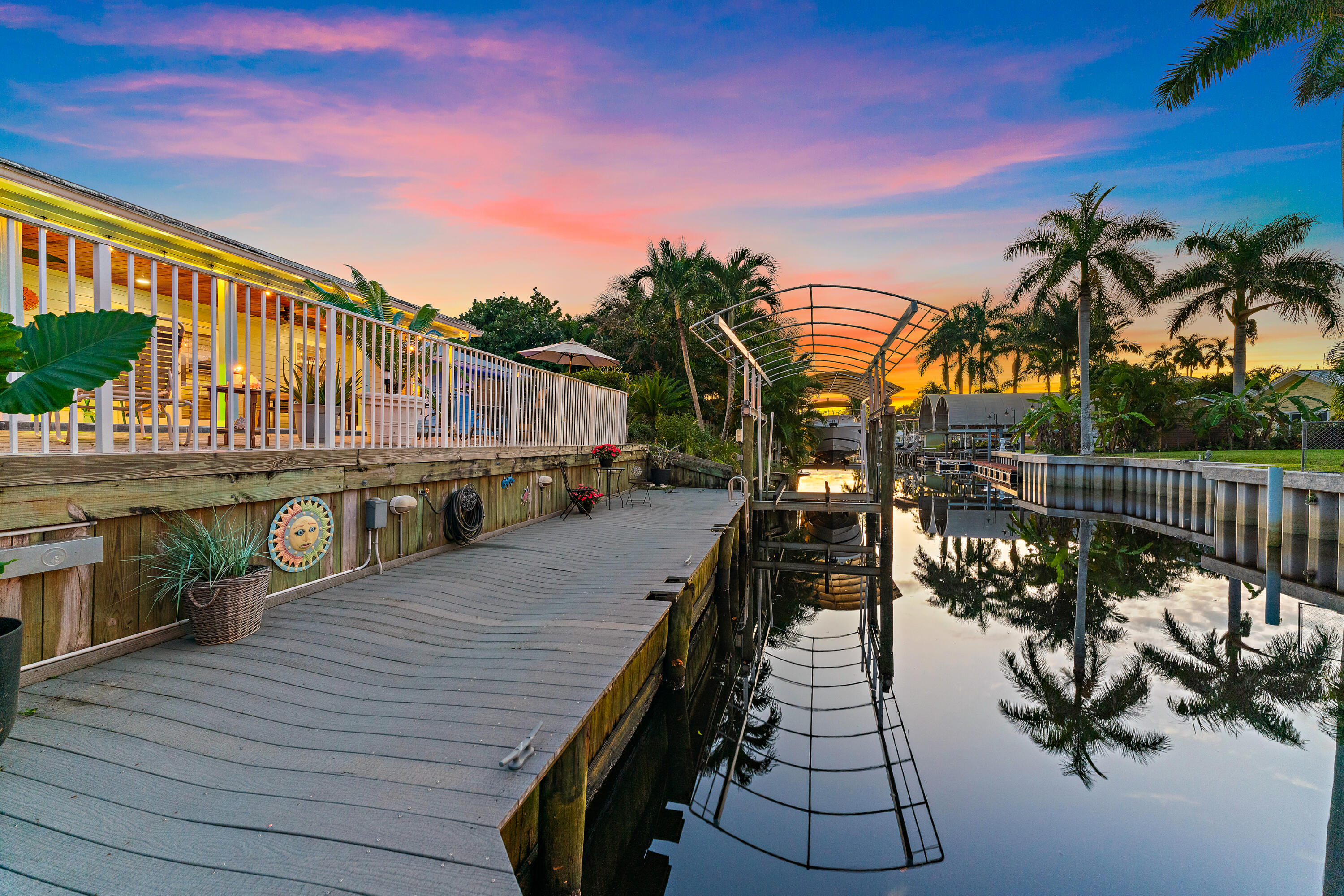 581 Southwest Timber Trail Stuart, FL 34997 - Photo 13 of 45 a balcony with wooden floor and a potted plant