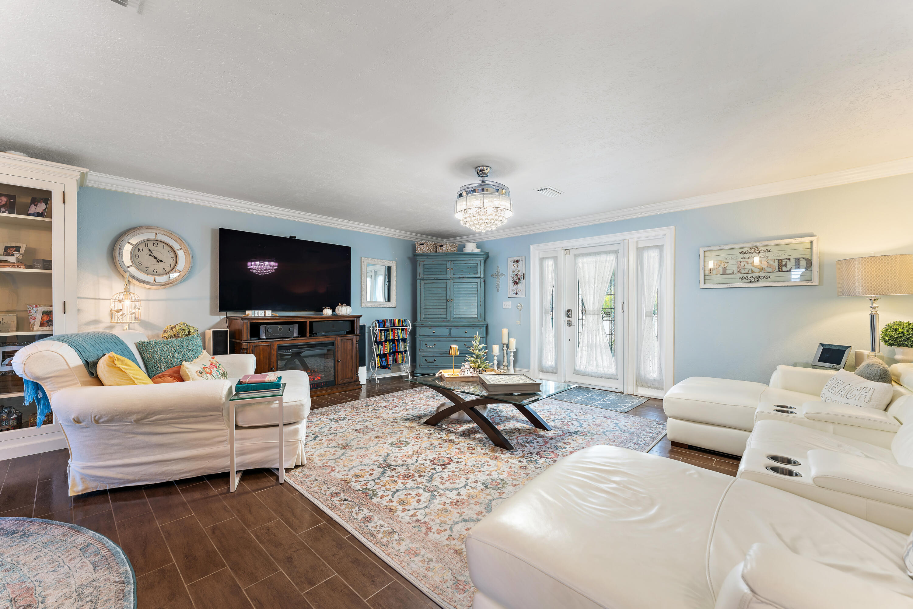 581 Southwest Timber Trail Stuart, FL 34997 - Photo 19 of 45 a living room with furniture flat screen tv and a window