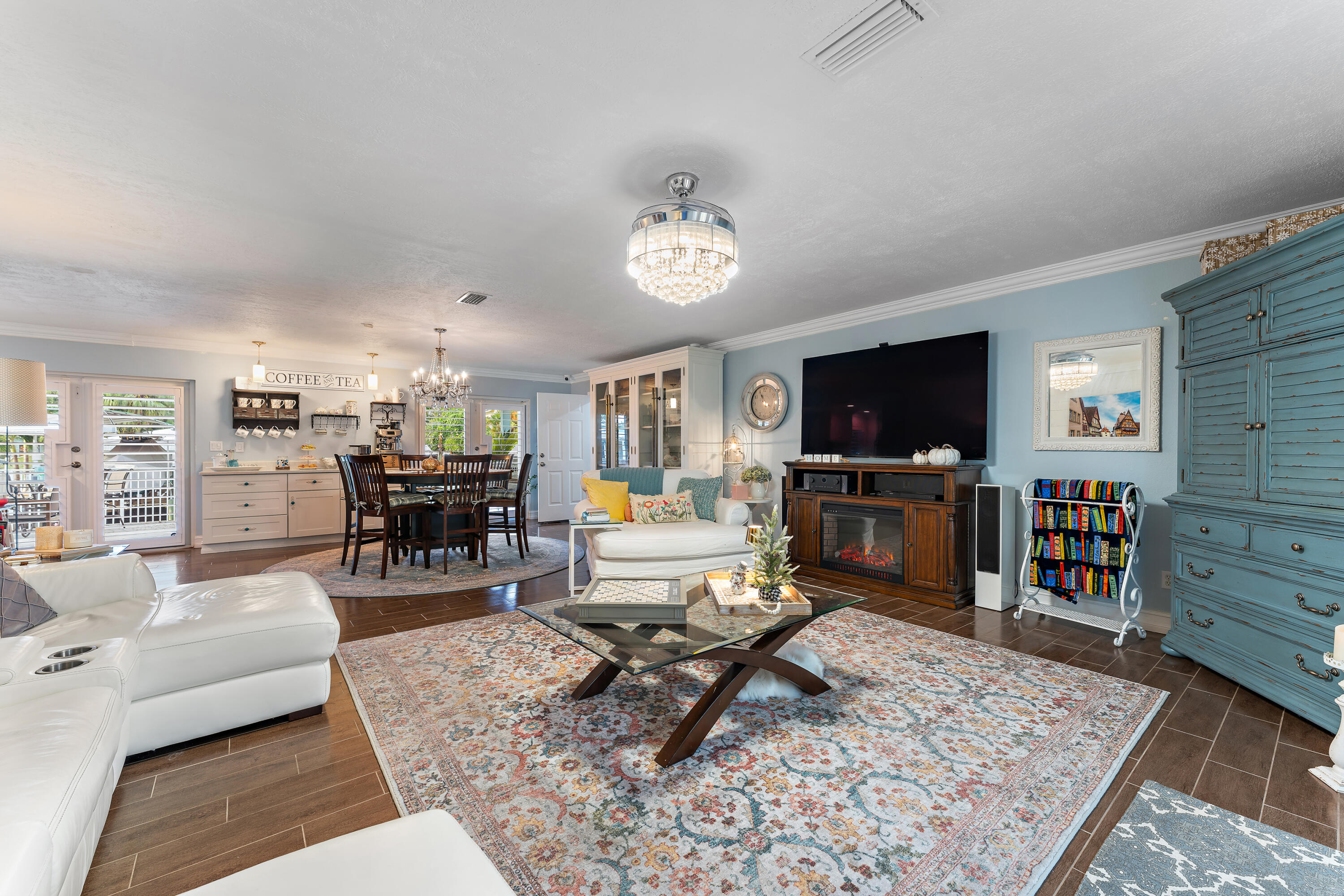 581 Southwest Timber Trail Stuart, FL 34997 - Photo 20 of 45 a living room with furniture and a flat screen tv