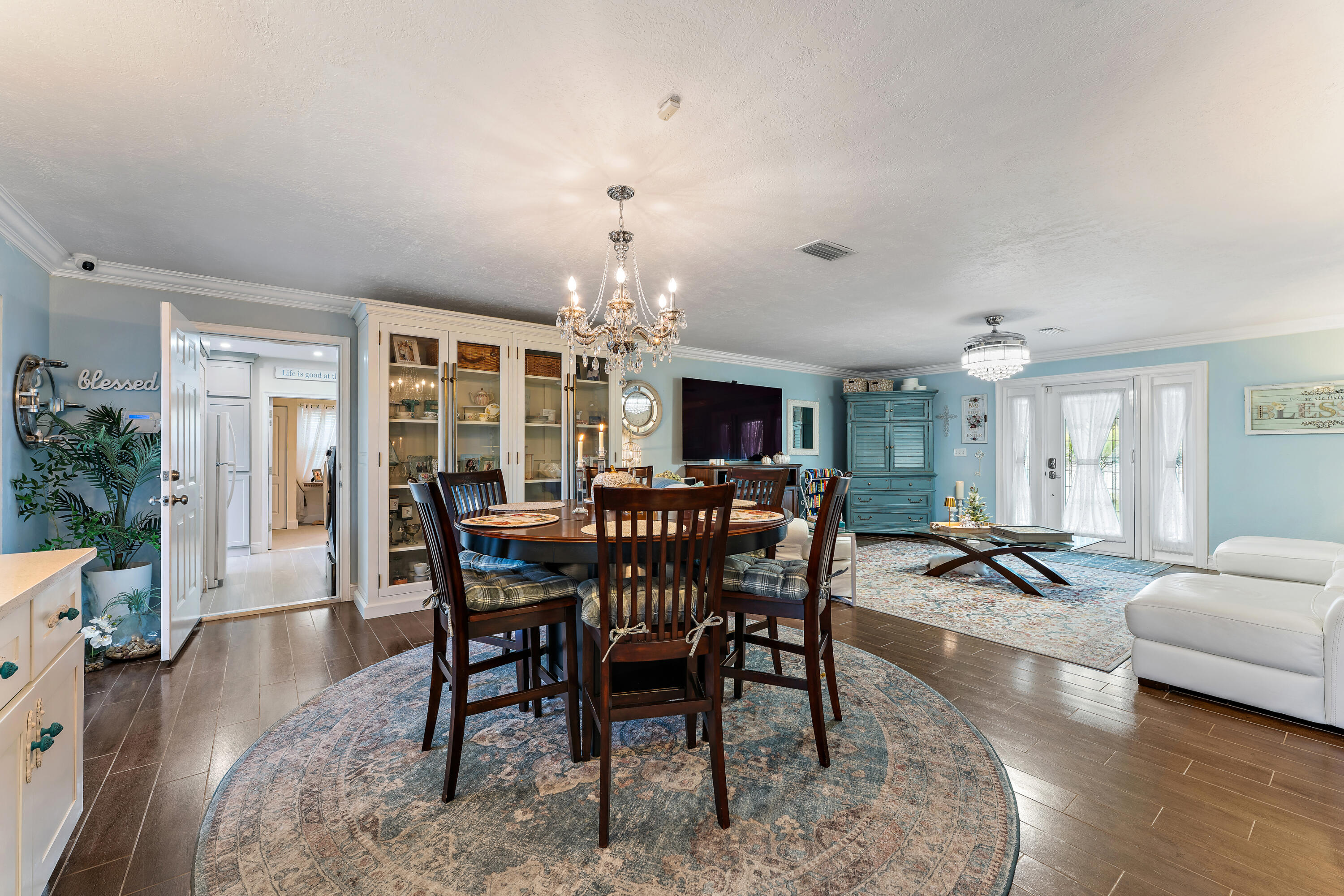 581 Southwest Timber Trail Stuart, FL 34997 - Photo 21 of 45 a view of a dining room with furniture window and wooden floor