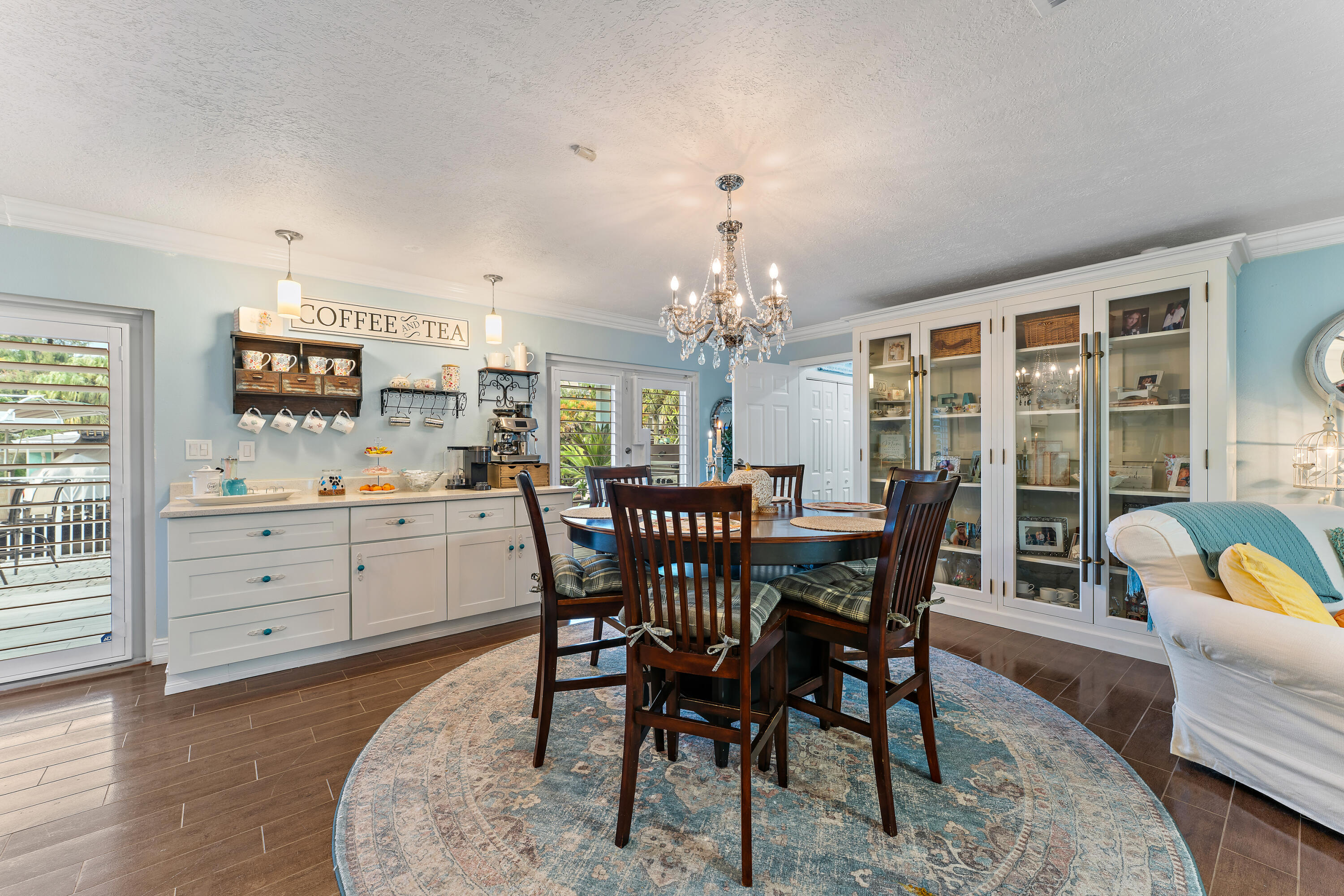 581 Southwest Timber Trail Stuart, FL 34997 - Photo 22 of 45 a view of a dining room with furniture and chandelier