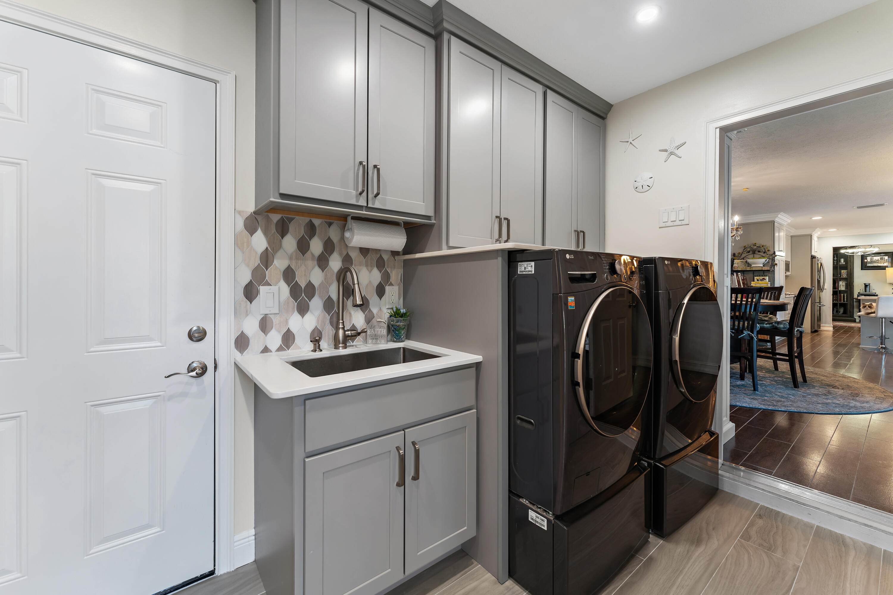 581 Southwest Timber Trail Stuart, FL 34997 - Photo 24 of 45 a utility room with cabinets
