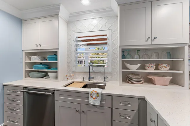 a view of a workspace with wooden floor and furniture