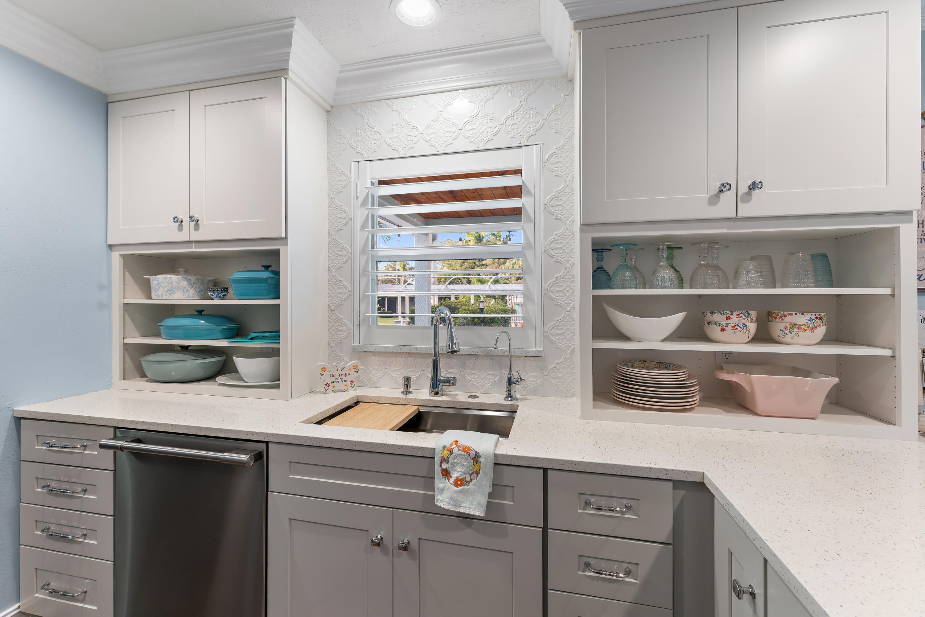 581 Southwest Timber Trail Stuart, FL 34997 - Photo 27 of 45 a kitchen with a sink and cabinets