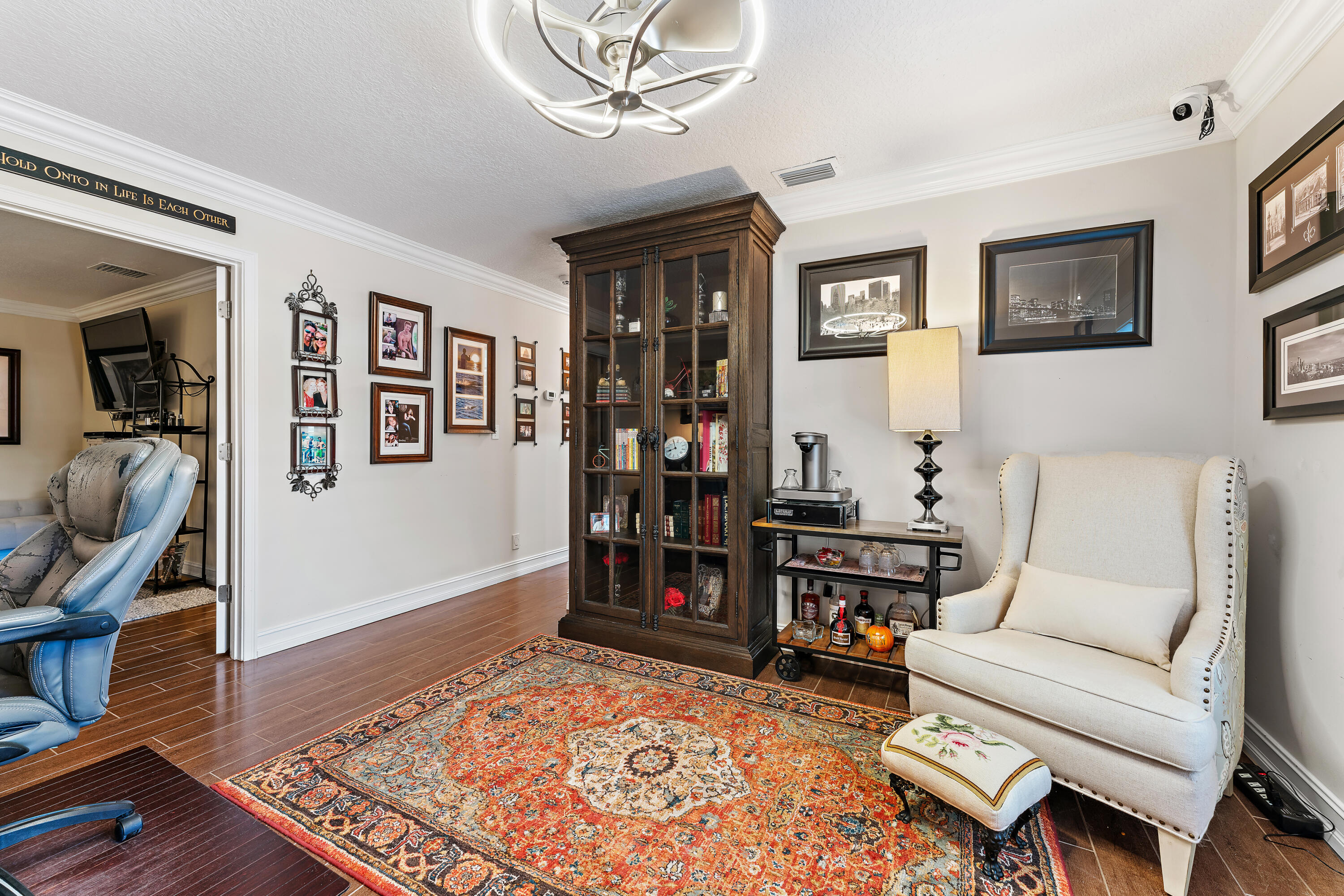 581 Southwest Timber Trail Stuart, FL 34997 - Photo 31 of 45 a living room with furniture and wooden floor