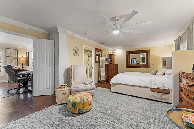 a view of walk in closet with clothes