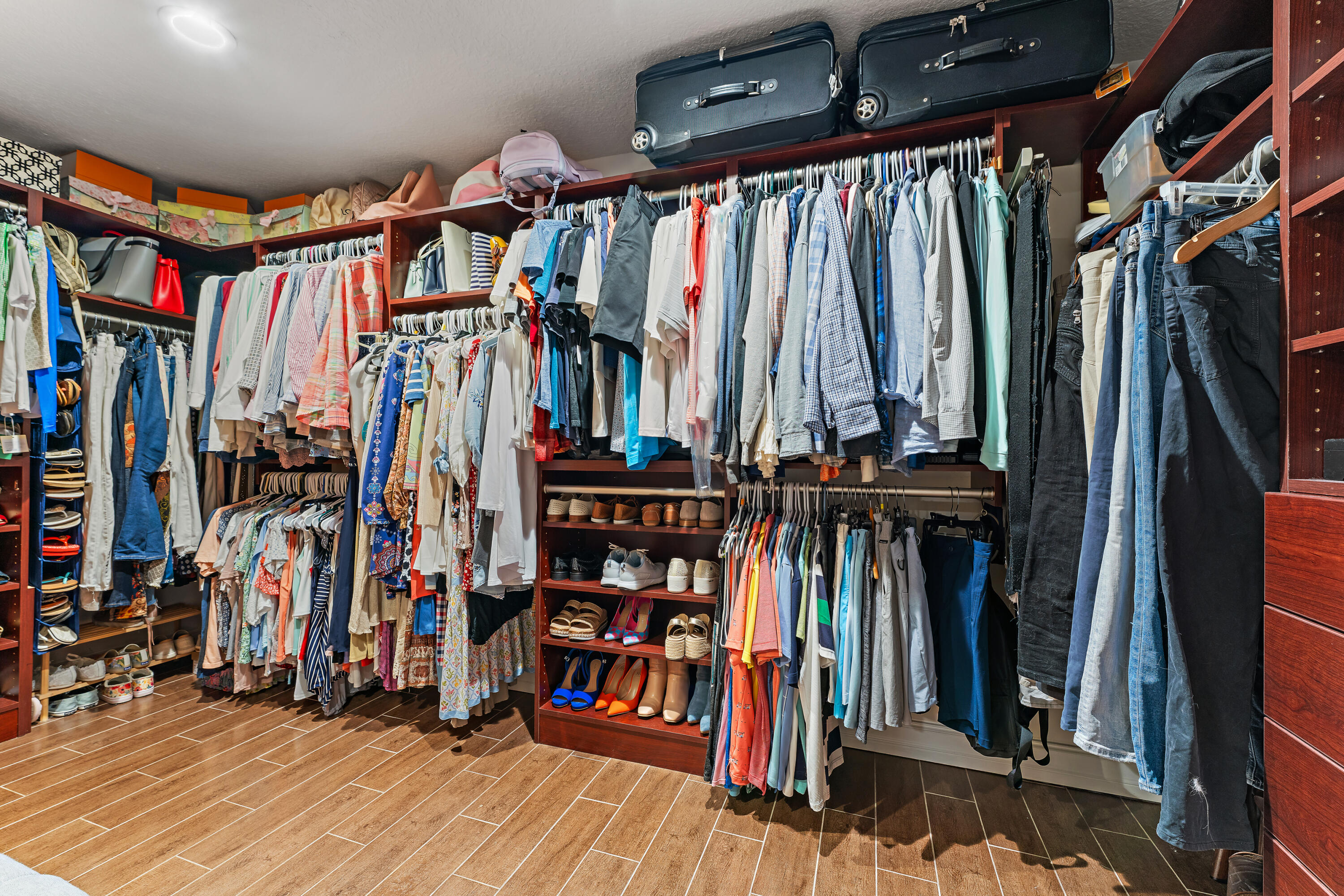 581 Southwest Timber Trail Stuart, FL 34997 - Photo 35 of 45 a view of walk in closet with clothes