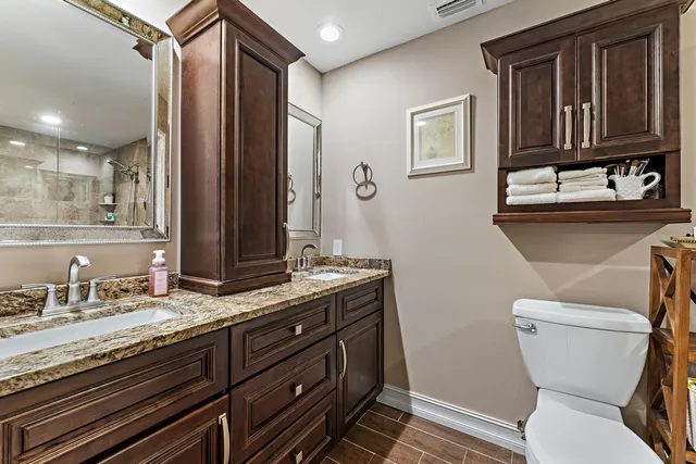 a bedroom with a bed and flat screen tv