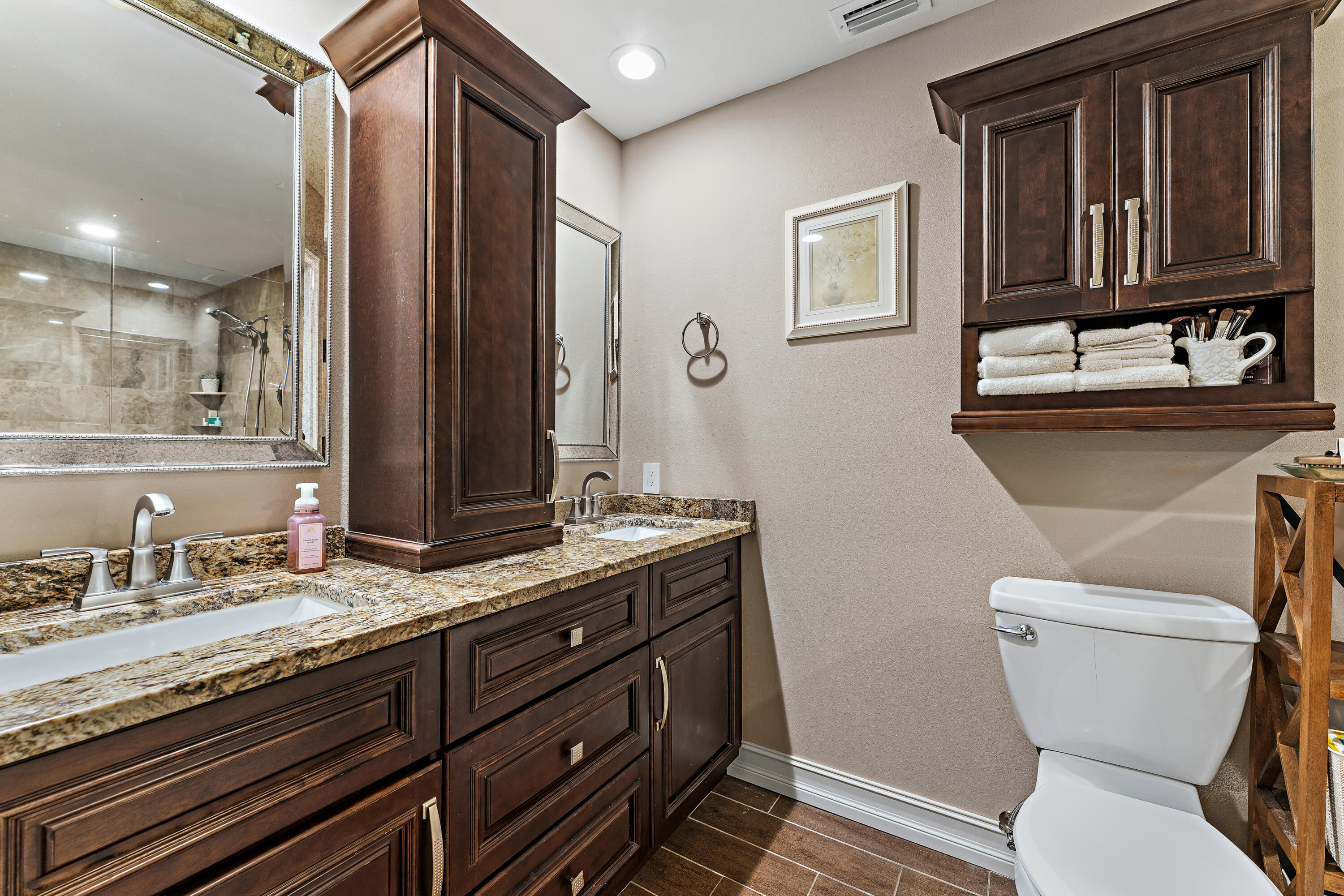 581 Southwest Timber Trail Stuart, FL 34997 - Photo 37 of 45 a bathroom with a granite countertop toilet sink and mirror