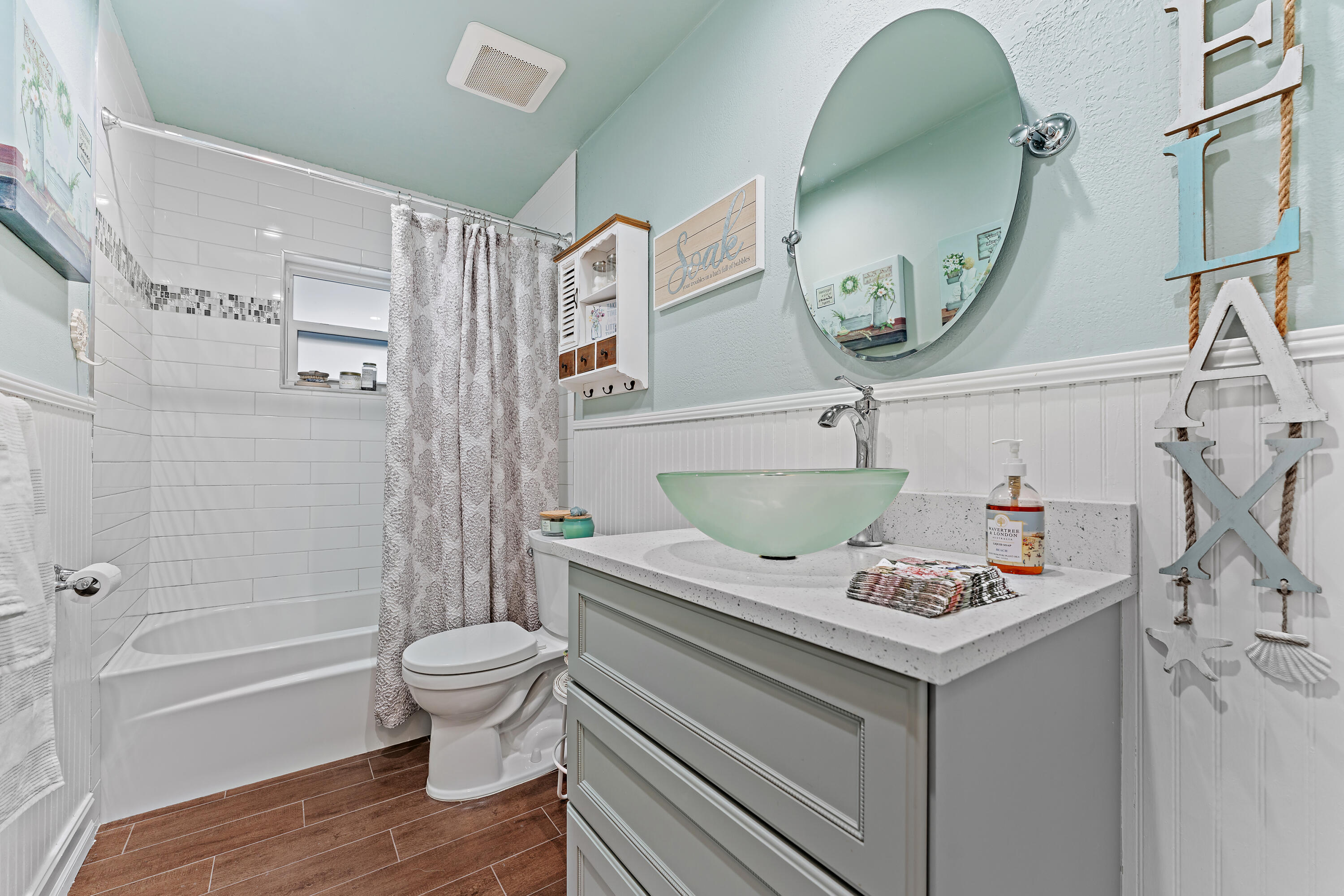 581 Southwest Timber Trail Stuart, FL 34997 - Photo 38 of 45 a bathroom with a granite countertop toilet sink and mirror