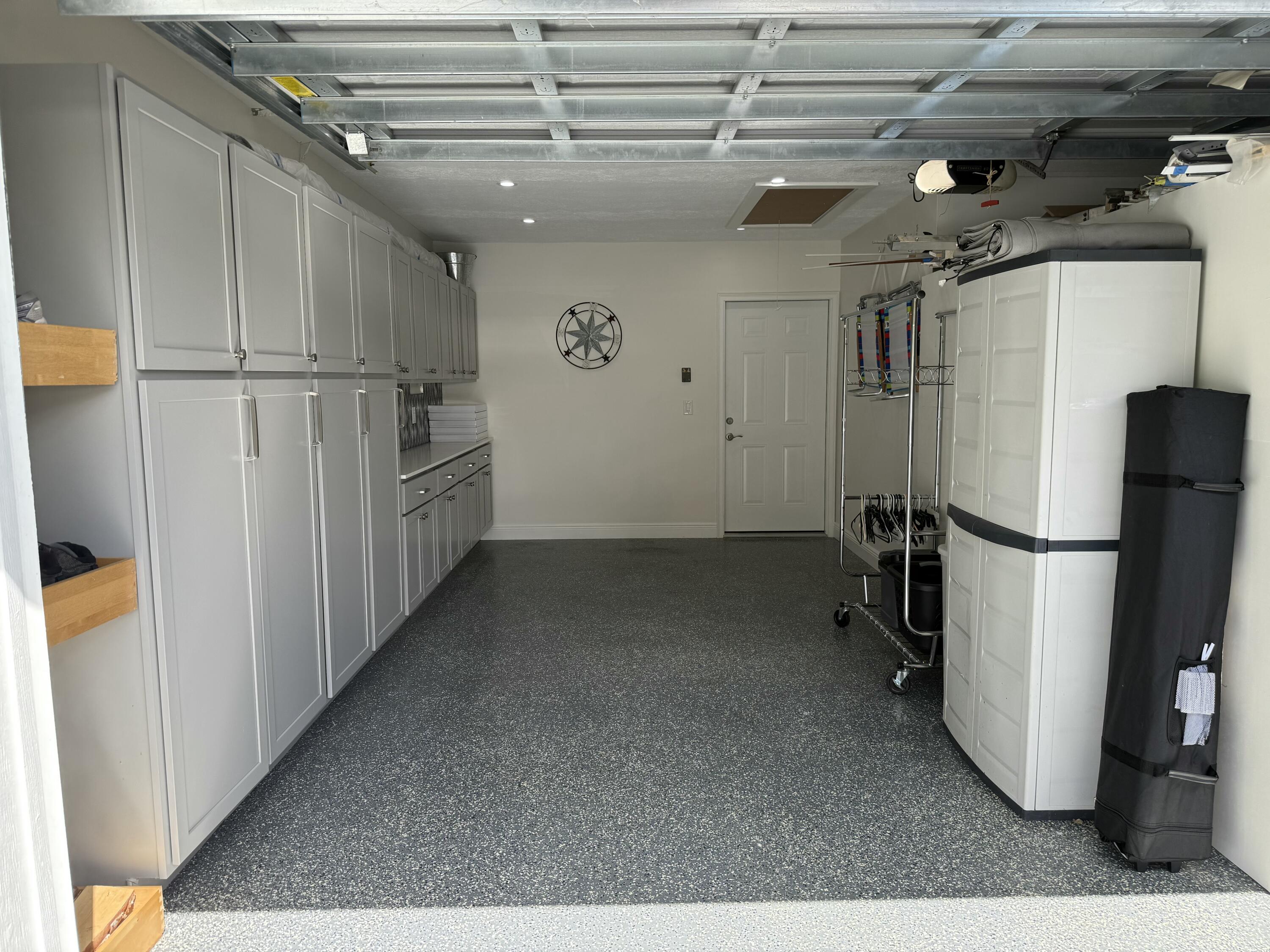 581 Southwest Timber Trail Stuart, FL 34997 - Photo 43 of 45 a view of a storage & utility room with refrigerator and washer