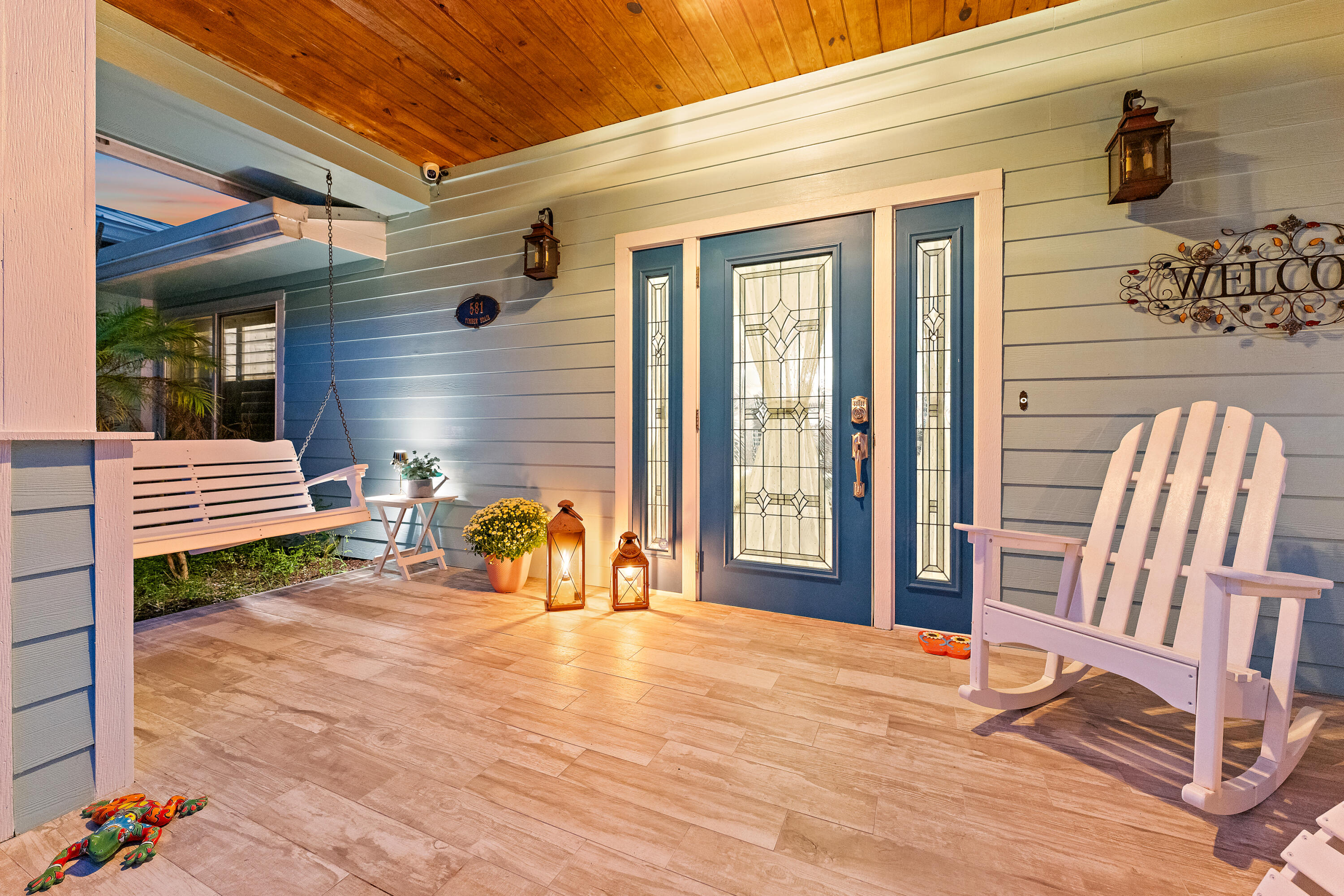 581 Southwest Timber Trail Stuart, FL 34997 - Photo 9 of 45 a backyard of a house with table and chairs