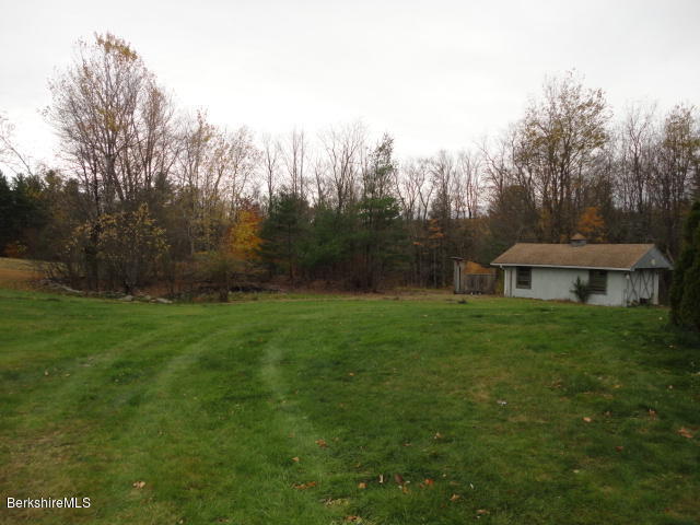 7 Windsor Bush Road Cummington, MA 01026 - Photo 22 of 27 a view of a big yard next to a house