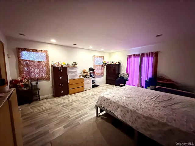 a bed room with a bed and dresser