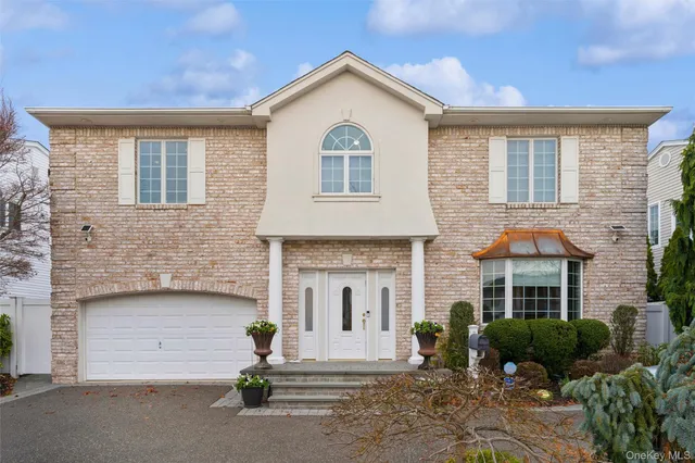 a front view of a house with yard