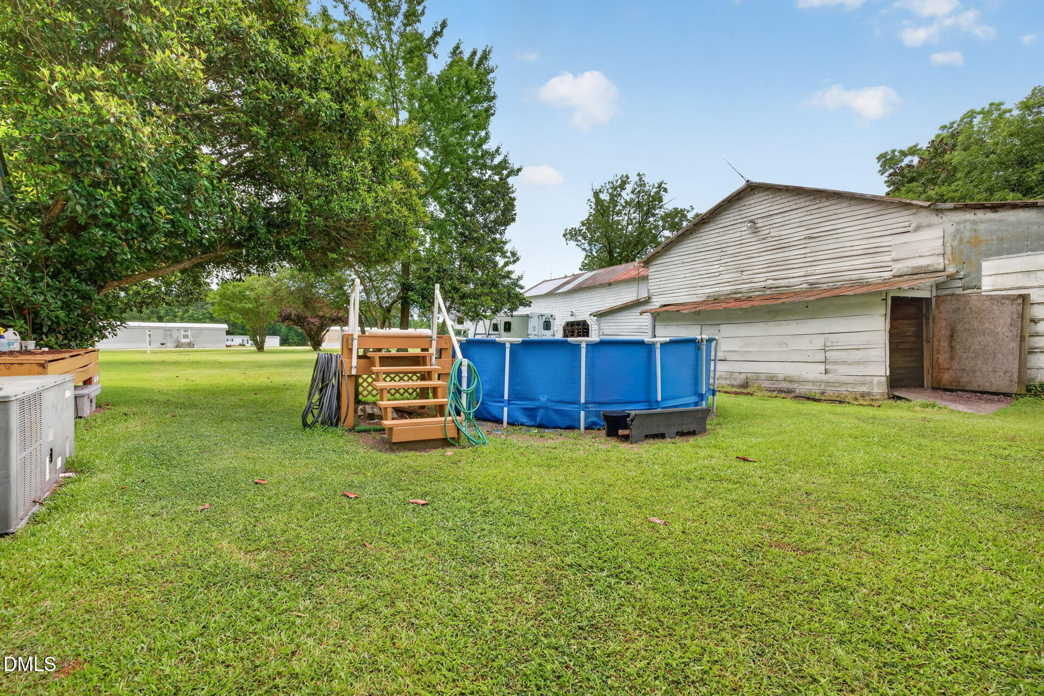 350 Grantham School Road Goldsboro, NC 27530 - Photo 27 of 49 a backyard of a house with a garden and deck